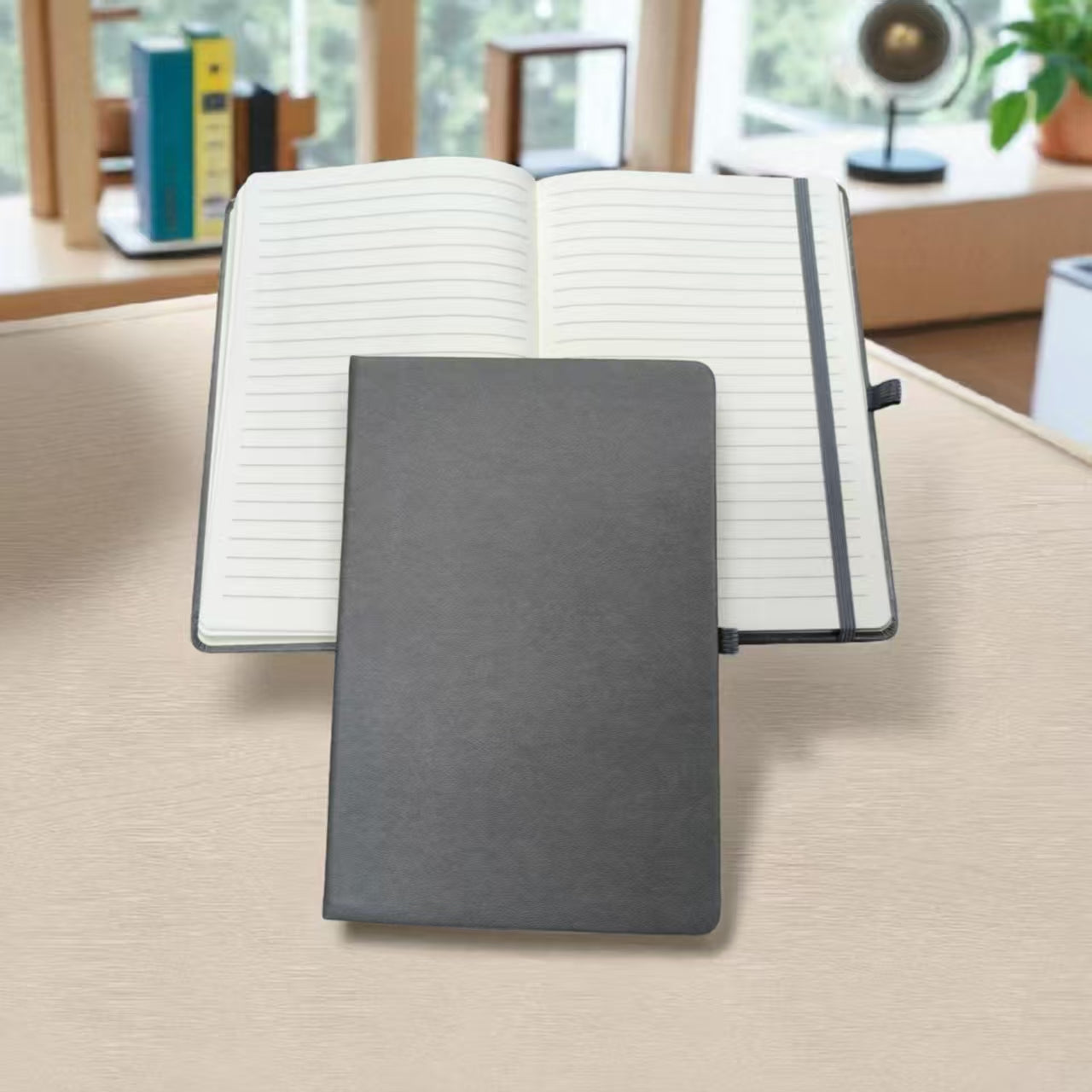 Personalised notebook in professional workspace showing corporate branding Singapore