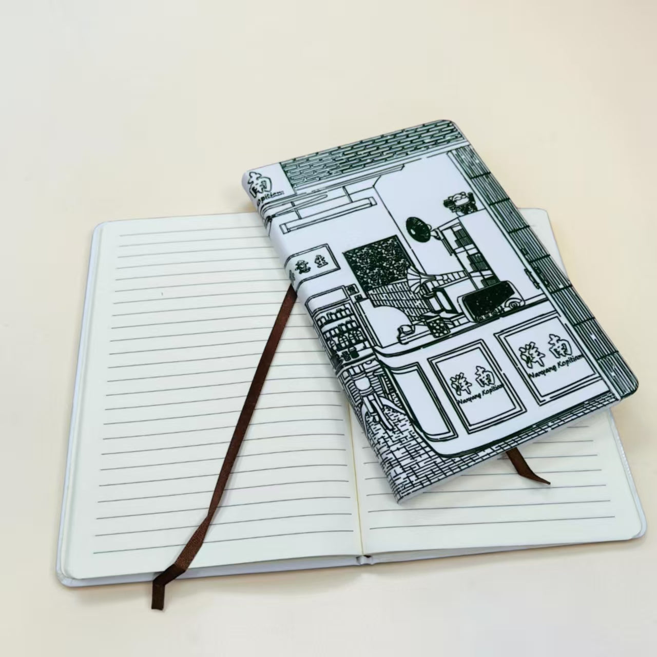 Custom printed notebook with corporate branding produced in Singapore facility showing full cover printing quality