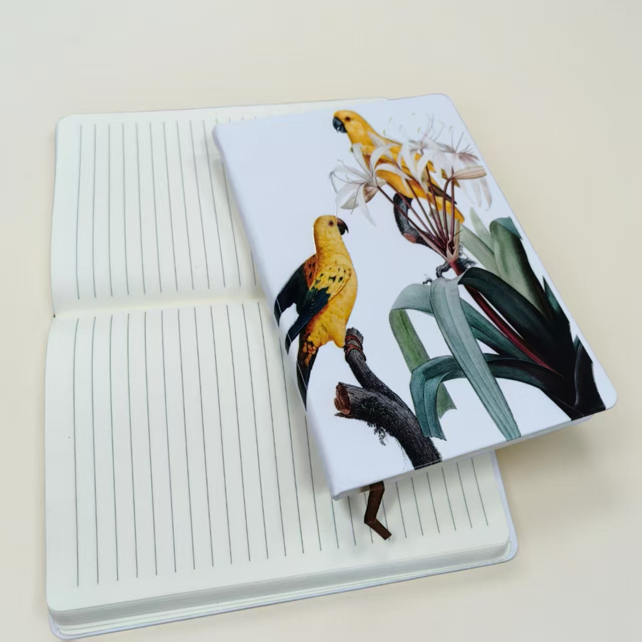 Collection of custom printed notebooks featuring various Singapore corporate branding designs and cover finishes