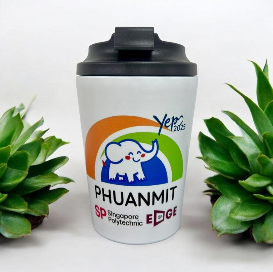 Multiple custom tumblers in various colors with corporate logos on modern office setting