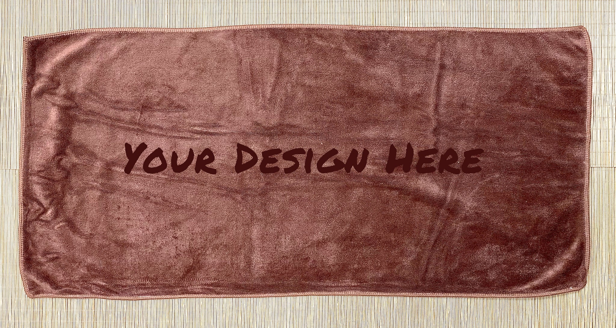Laser engraving custom logo on premium cotton towel in Singapore printing facility