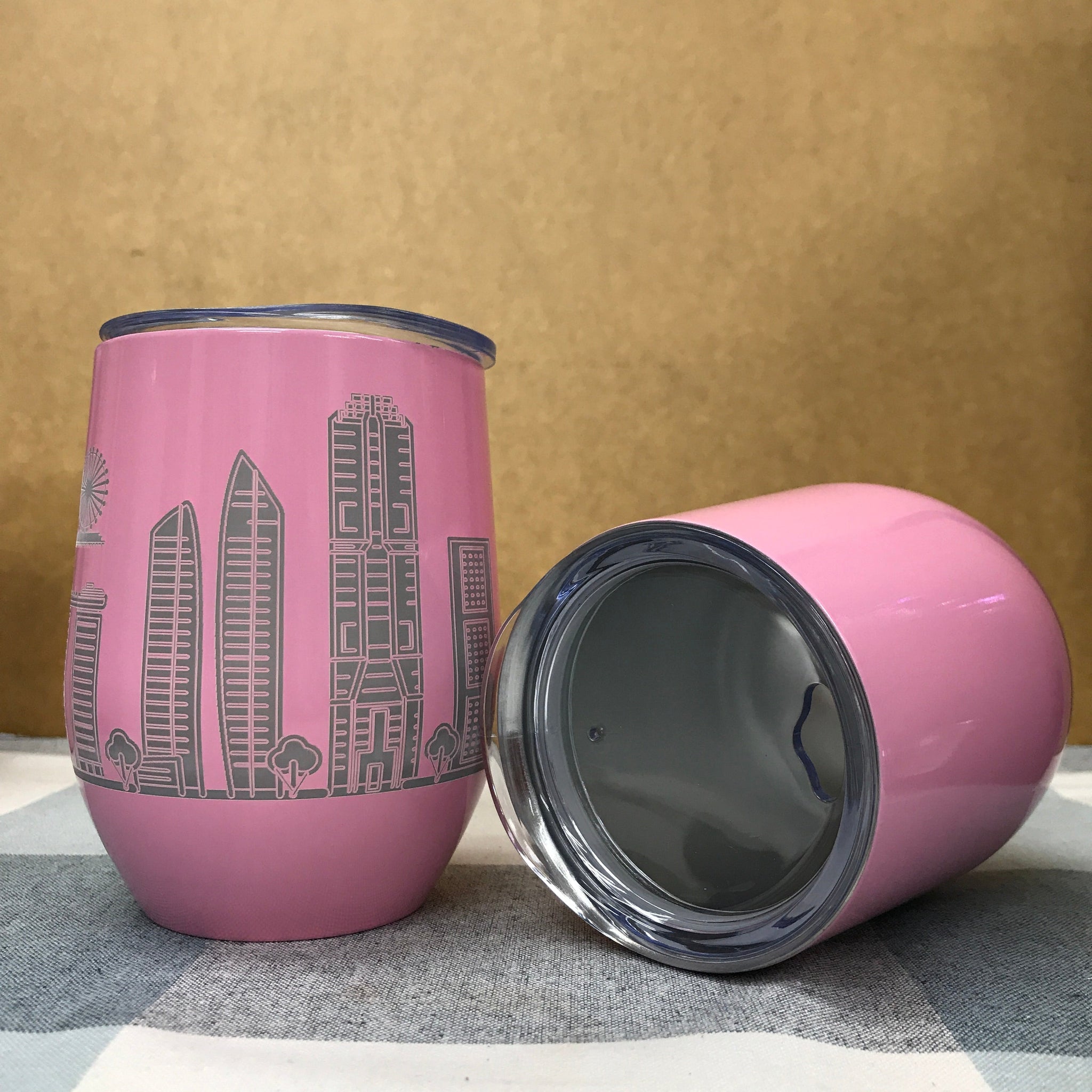 Custom tumbler with student backpack showing compact portable design for campus and office use
