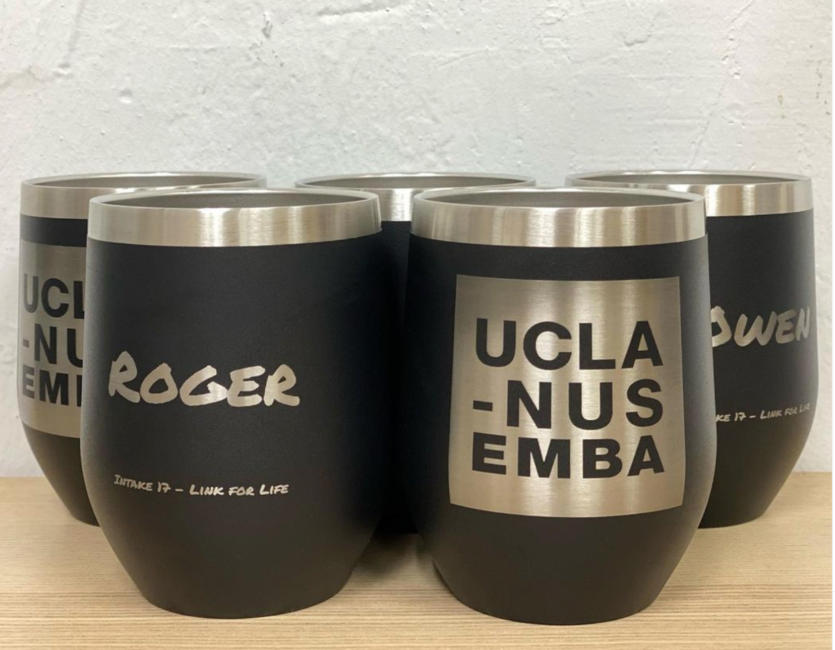 Custom tumbler with student backpack showing compact portable design for campus and office use