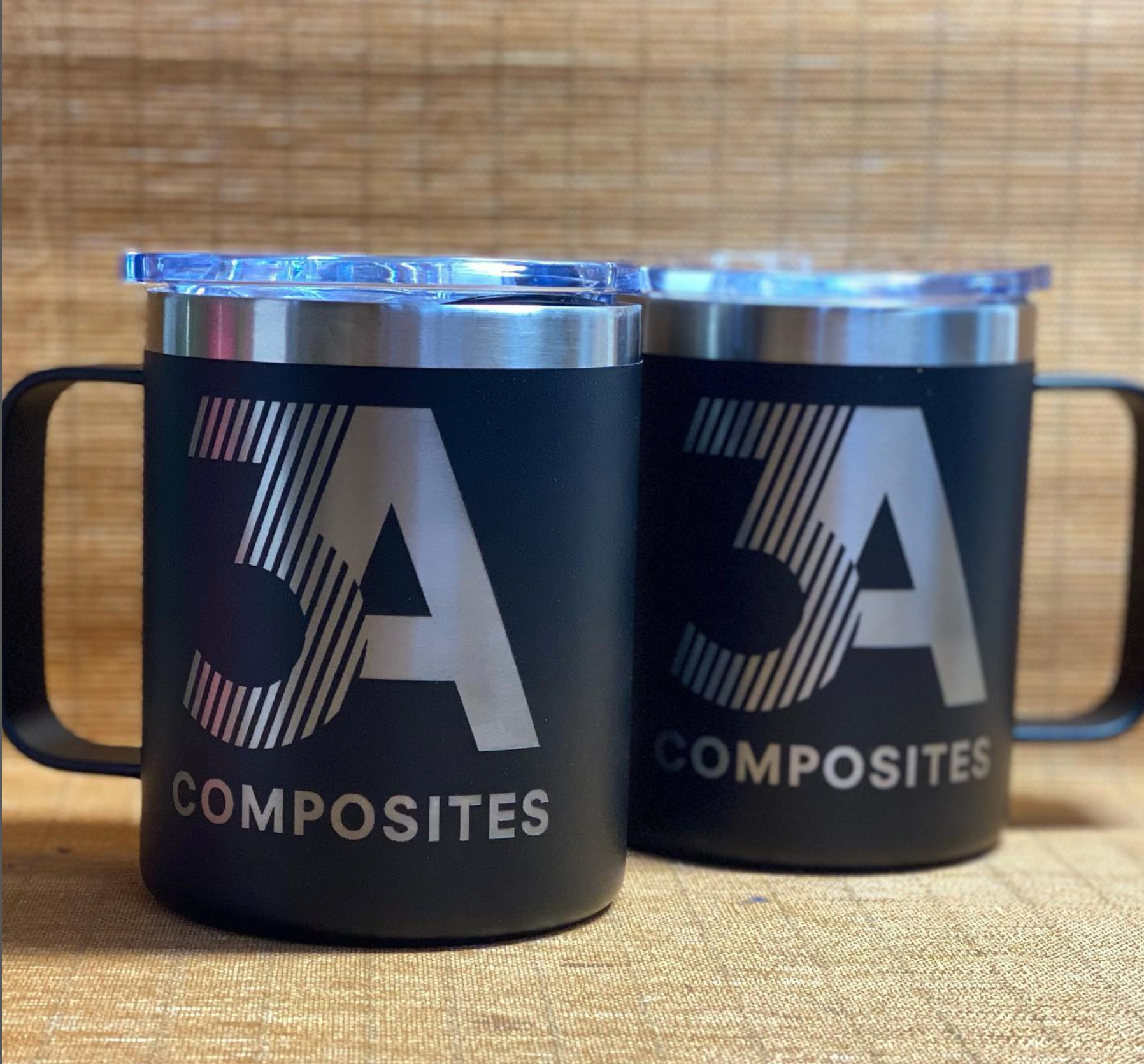 Custom ceramic mug with professional workspace showing corporate branding on office desk