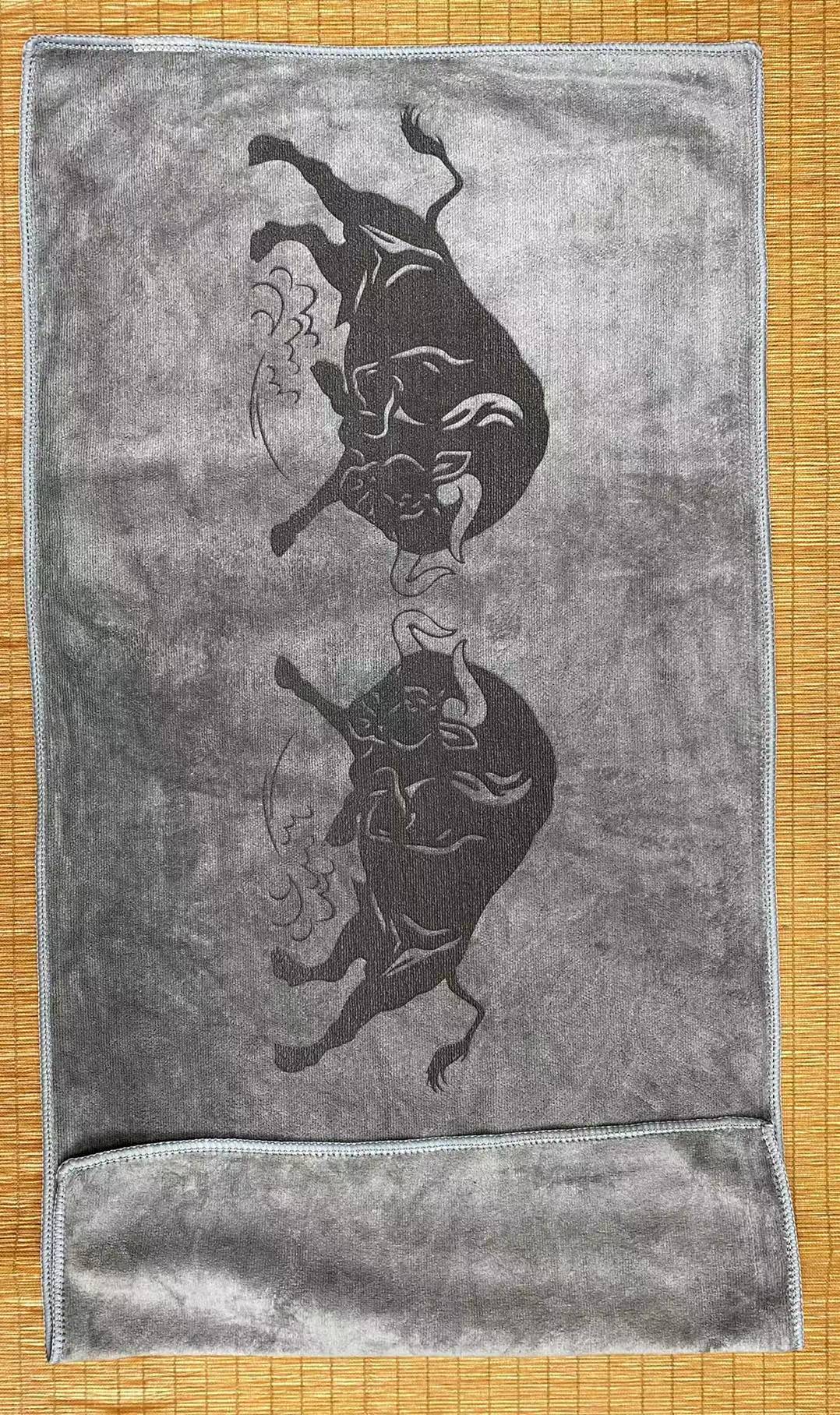Laser engraving custom logo on premium 70x50cm tea towel in Singapore printing facility