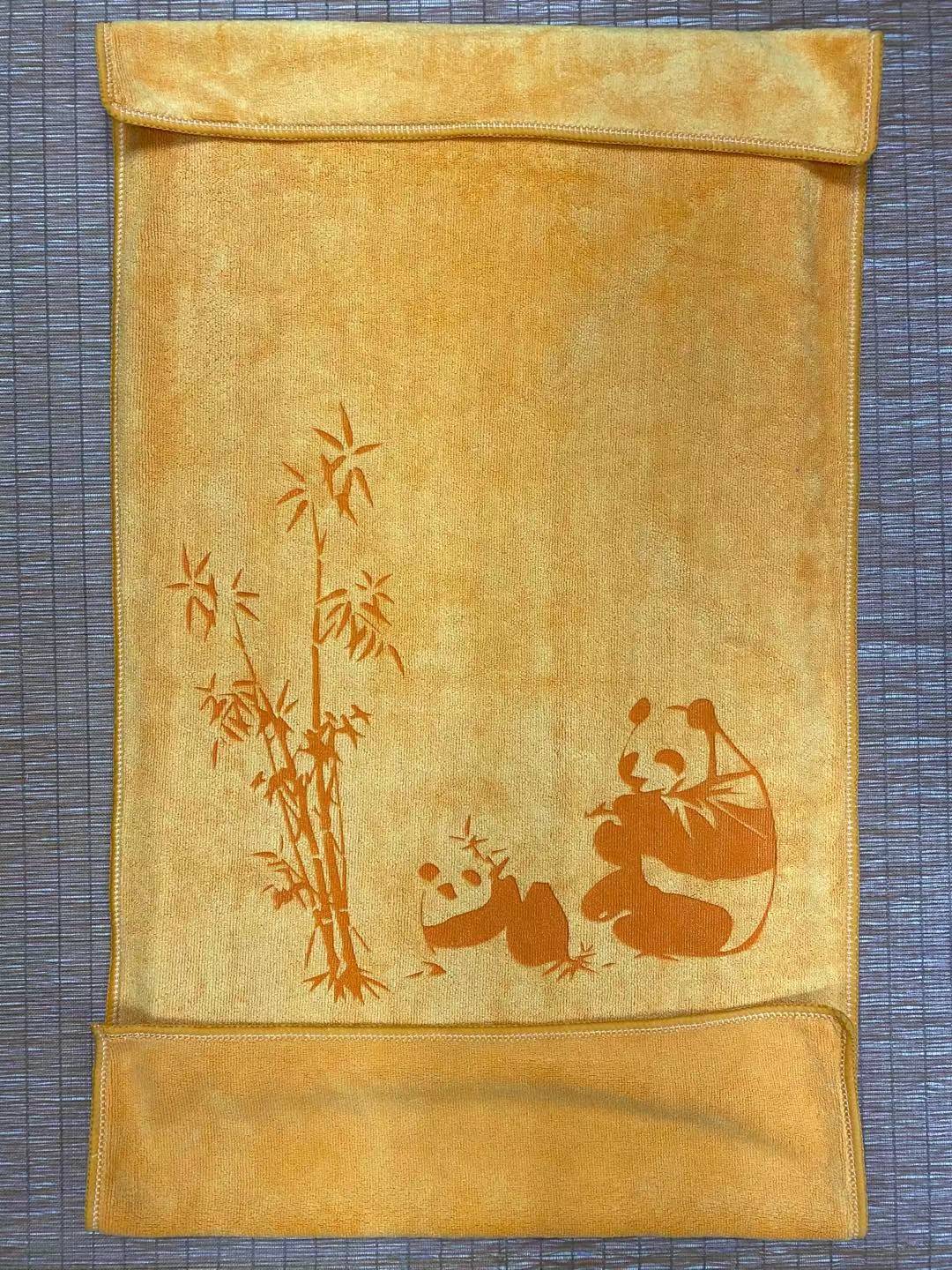 Close-up of precision towel engraving showing detailed custom branding