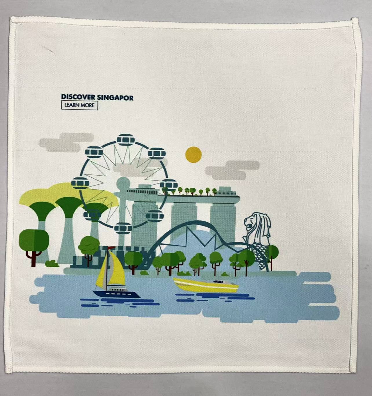Range of custom printed corporate towels with various Singapore business logos
